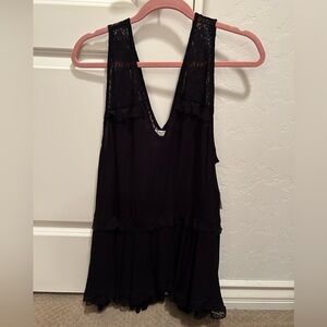 Free people black lace top in size medium. New with tags.
